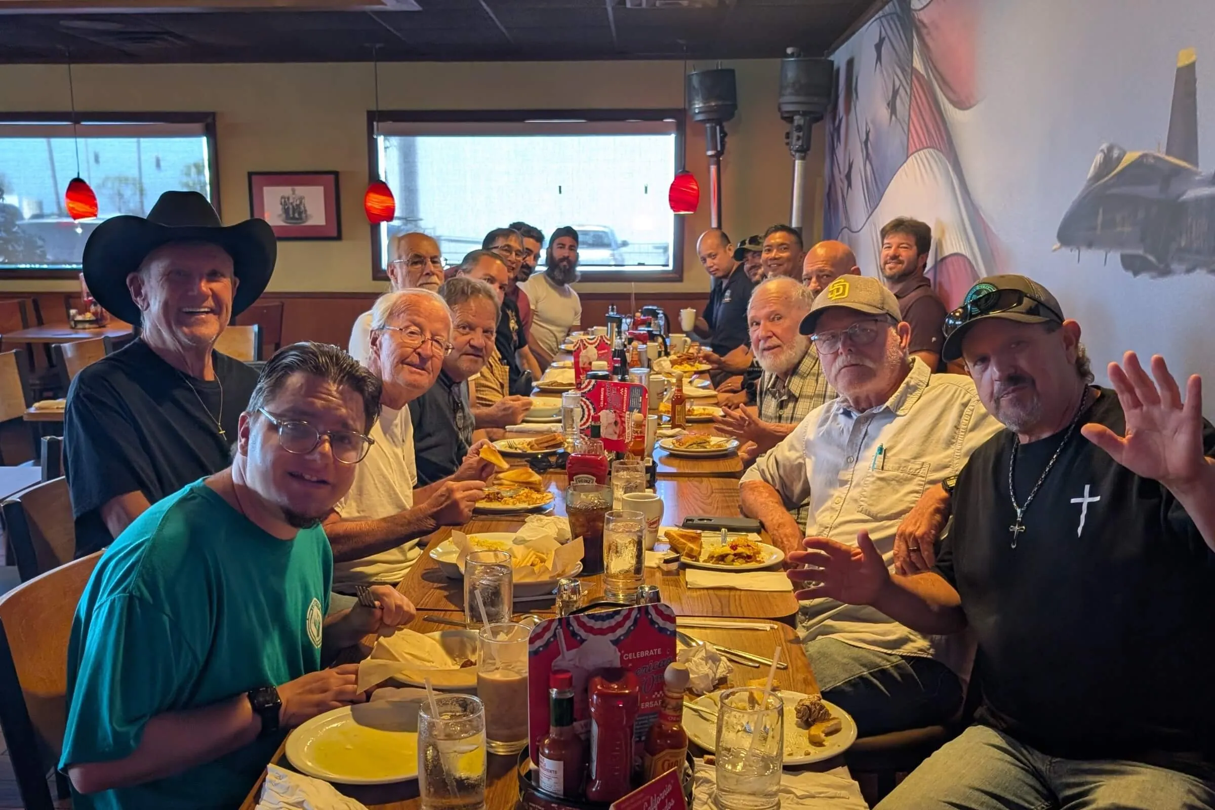 Men gathering together around a table